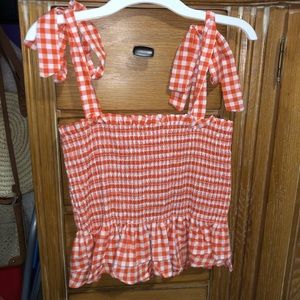 Orange plaid top with ruffles